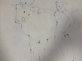 drawing of a cow and a man on a sheet of paper
