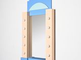 a mirror that is hanging on the wall in the room