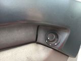a close up of a car door handle with a button on it