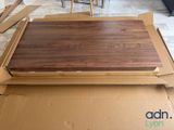 a cardboard box that has a wooden floor in it