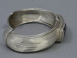 an image of a close up of a coil of wire on a table