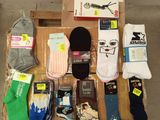 many pairs of socks that are sitting on a box