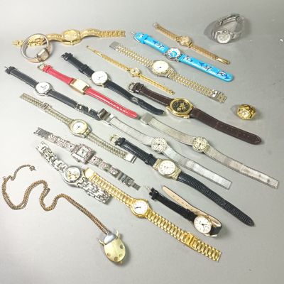 a lot of watches that are sitting on a table