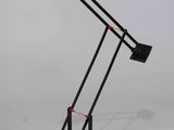 the black lamp is on a white surface with a white background