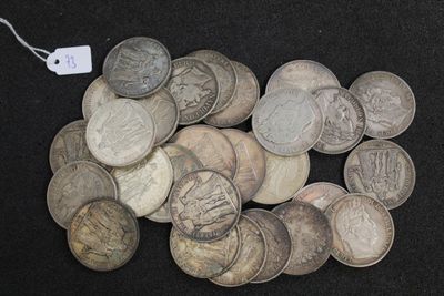 a lot of coins that are on a black surface