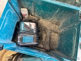 a blue tool box with tools inside of it