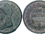 an old coin with a woman ' s face on it