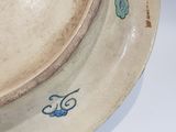 a bowl with a flower design on it on a table