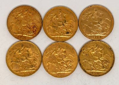 six souverains d'or de tailles et de formes différentes