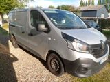 a silver van that is parked on the side of the road