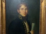 tableau représentant un homme tenant un livre, dans un cadre doré