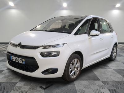 the white citrole is parked on a checkered floor