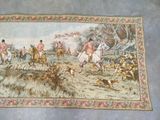 a tapestry with a picture of a hunting scene on it