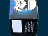 a box of toothpaste sitting on a blue surface