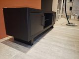 an image of a black entertainment center in a living room