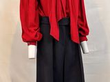 an image of a mannequin wearing a red shirt and black skirt