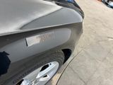 a close up of a car ' s hood with a sticker on it