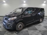 a picture of a black van parked on a checkered floor