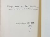an open book with a handwritten quote on the cover