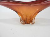 a glass bowl that is sitting on a table