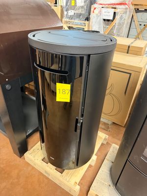 an image of a metal trash can sitting on a pallet in a warehouse