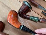 many different types of pipe smokings on the table