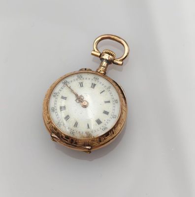 an antique gold pocket watch with roman numerals and roman numerals
