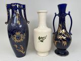 three vases sitting next to each other on a table