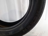 a close up of a tire on a white surface