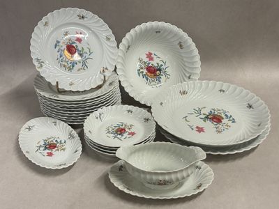 a lot of plates and bowls sitting on a table
