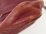 a brown purse that is sitting on a table