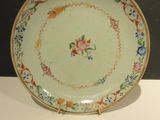 a plate with a floral design on it on a table