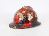 a red hard hat with a gold leaf design on it