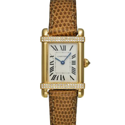 a lady ' s cartier tank watch with diamonds and leather strap