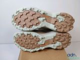 the soles of a pair of shoes are shown on top of a cardboard box