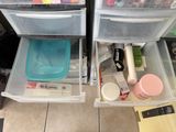 two drawers that have various items inside of them