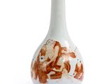 a white vase with a picture of a man and a woman on it