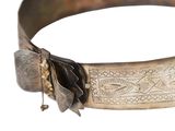 a close up of a metal bracelet with a flower on it