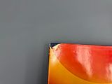 a book that is sitting on a table next to a wall