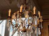 a chandelier hanging from the ceiling in a room