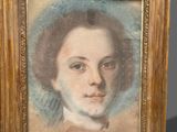 portrait of a young man in a gold frame