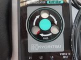a remote control that is sitting next to a keyboard