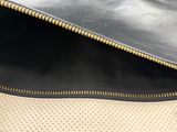 the inside of a black and white purse with a zipper