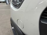 a close up of the front of a white car