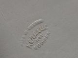 a white plate that has a design on it