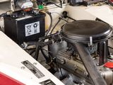 a red and white car with a black engine and a red and white car with a black engine and a red and white car with a black engine