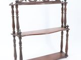 an image of a wooden shelf with three shelves on it