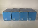 four boxes of blue boxes with white writing on them sitting on a table