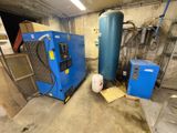 a blue machine and a blue tank in a room