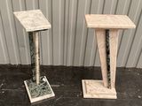 pair of marble pedestals with a marble top and a marble base